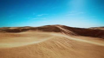 wide and wild landscape of the Arabic sand desert photo