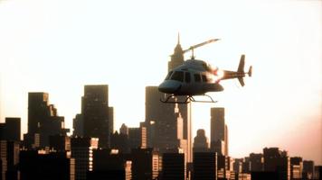 Silhouette helicopter at city scape background photo