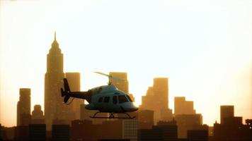 Silhouette helicopter at city scape background photo