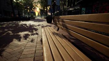 Park bench in downtown on a cloudy afternoon photo