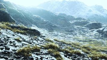 lanscape with barren mountain which is covered with ice photo