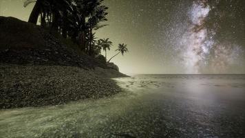 Beautiful fantasy tropical beach with Milky Way star in night skies photo