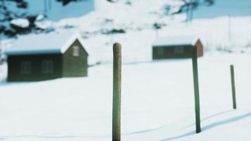 old worn abandoned house in norwegian winter landscape photo