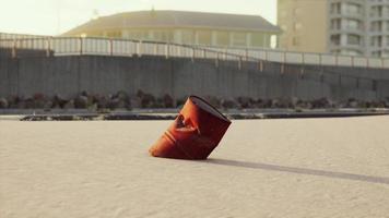 old oil barrell on the sand beach photo