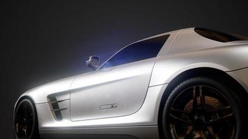 luxury sport car in dark studio with bright lights photo