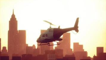 Silhouette helicopter at city scape background photo