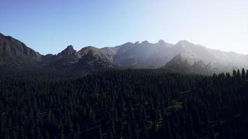 Landscape view of the mountain range with trees in the fall photo