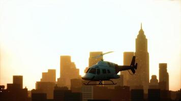 Silhouette helicopter at city scape background photo