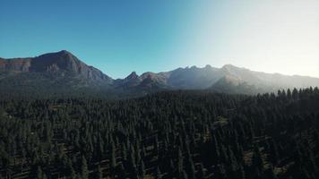 Landscape view of the mountain range with trees in the fall photo