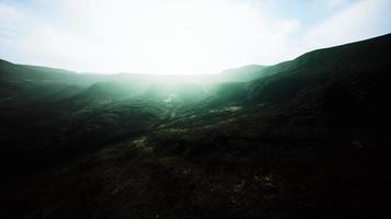 black mountains in deep fog photo