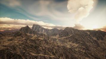 Sun Rays against the Backdrop of the Mountains photo