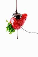 Strawberry with liquid chocolate photo
