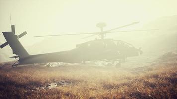 military helicopter in mountains at war photo