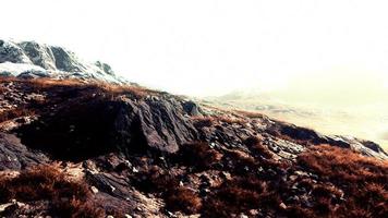 landscape of mountains with dry grass in summer season photo