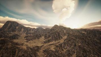 Sun Rays against the Backdrop of the Mountains photo