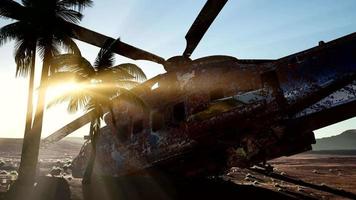 old rusted military helicopter in the desert at sunset video