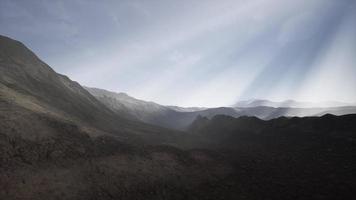 Sun Rays against the Backdrop of the Mountains photo