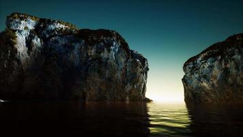 rocky cliff at cold sea water video