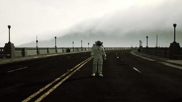 astronaut walks in the middle of a road video