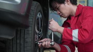 technician workshop service, mechanic change car tire and wheel in automobile garage, vehicle transportation maintenance and auto repair tool, man person occupation with tyre in job video