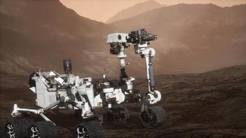 Curiosity Mars Rover exploring the surface of red planet. Elements of this image furnished by NASA video