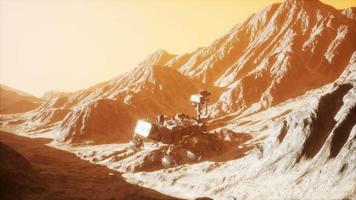 Curiosity Mars Rover exploring the surface of red planet. Elements of this image furnished by NASA video