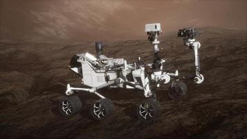 Curiosity Mars Rover exploring the surface of red planet. Elements of this image furnished by NASA video