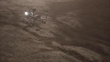 Curiosity Mars Rover exploring the surface of red planet. Elements of this image furnished by NASA video