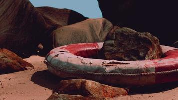 old broken Lifebuoy on sea beach photo