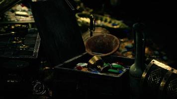 treasures in a dark cave with coins diamonds and gold photo