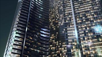 Night architecture of skyscrapers with glass facade photo