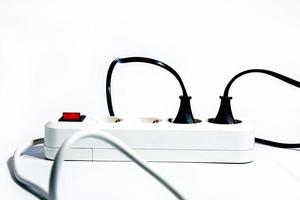 Extension cord with a button on a white background. Isolate. Copy space. Front view. photo