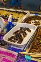 Thai food sale eating insects Khaosan Khao San Road Bangkok. photo
