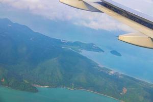 Flying over Thailand panoramic view of islands beaches turquoise waters. photo