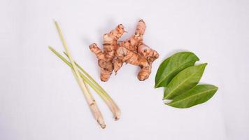 various spices, lemongrass, bay leaves and galangal isolated on white background photo