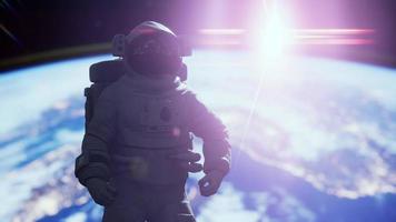 Space man astronaut in space on a background of the blue planet Earth video