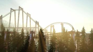 old roller coaster at sunset in forest video