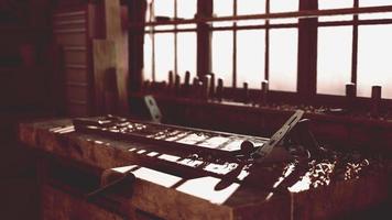 Retro stylized old tools on wooden table in a joinery video