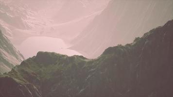 Rocks covered with grass under a cloudy sky video