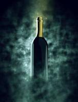 Bottle of wine in smoke with bokeh photo