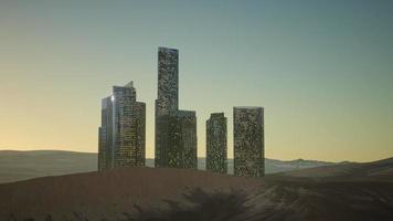 rascacielos de la ciudad en la noche en el desierto