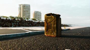 old metal fuel canister on beach parking photo