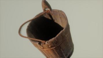 Old used rusted wooden bucket photo