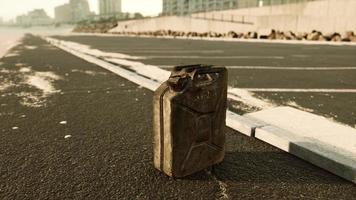 old metal fuel canister on beach parking photo