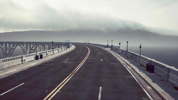 empty bridge fragment near the mountains photo