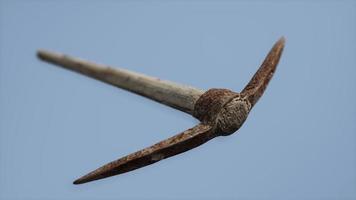 Close up of an old rusted pickaxe head photo