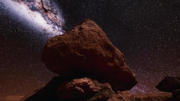 red rocks and milky way night sky in Moab Utah photo