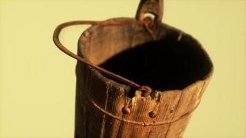 Old used rusted wooden bucket photo