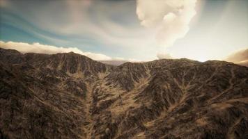 Sun Rays against the Backdrop of the Mountains video