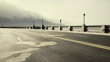 View of the bridge over the river in fog video